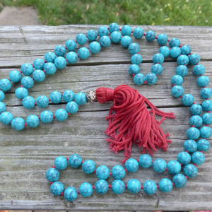 Faux turquoise mala bead fashion necklace with red tassel